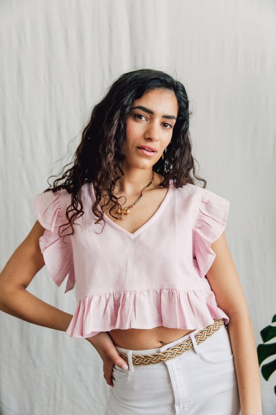 Raw cotton Lilly Top with delicate ruffle detail.