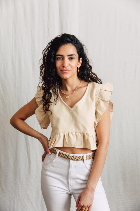 Raw cotton Lilly Top with delicate ruffle detail.