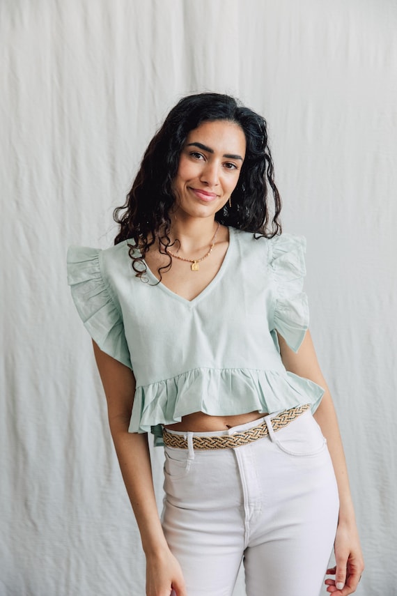 Raw cotton Lilly Top with delicate ruffle detail.