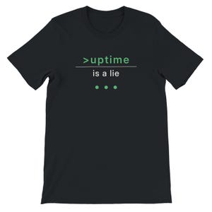 May include: Black t-shirt with the text ">uptime is a lie" in green and white. The shirt has a crew neck and short sleeves. Below the text are three green dots.