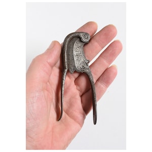 Antique Signed and inlaid Betel Nut cutter. 19th Century, from Indonesia.