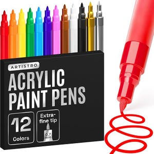 May include: A set of 12 acrylic paint pens in a black box. The pens are in various colors, including red, orange, yellow, green, blue, purple, brown, white, black, gold, and silver. The box has the text "ARTISTRO ACRYLIC PAINT PENS" and "12 Colors". The pens have an extra-fine 0.7 mm tip.