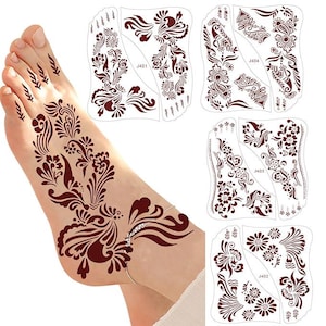 May include: A foot with a henna design featuring intricate floral and paisley patterns in a deep reddish-brown color. Four henna stencil designs are also visible, each with unique floral and leaf patterns. The stencils are labeled J401, J402, J403, and J404.