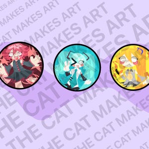 May include: Three circular art prints featuring anime-style characters with distinct color schemes: red, teal, and yellow. Each character is set against a colorful background. The text "THE CAT MAKES ART" is printed on the background.