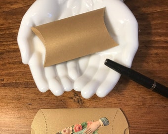 A set of 6 mini pillow boxes with gold paper