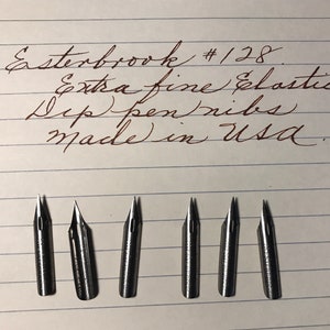 May include: Six silver Esterbrook #128 extra fine elastic dip pen nibs. The nibs are made in the USA.