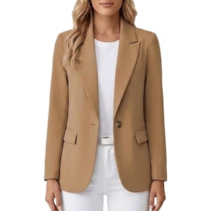 May include: A tan blazer featuring a single-button closure, notched lapels, and two front flap pockets. The blazer is worn over a plain white t-shirt and white pants, showcasing a structured fit with long sleeves and a clean, solid-colored design.