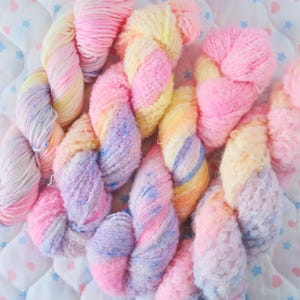 May include: A rustic wooden sign with the text "Welcome to our home" in white lettering. The sign has a distressed finish and a simple, inviting design, ideal for front door decor.