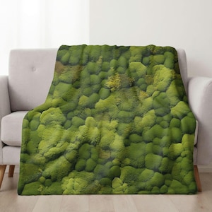 May include: A green moss throw blanket with a textured, natural look. The blanket is made of soft, plush fabric and is perfect for adding a touch of nature to your home decor.