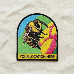 May include: A white ceramic mug with a black handle and the text "But first, coffee" in a handwritten style. The mug is on a white surface.