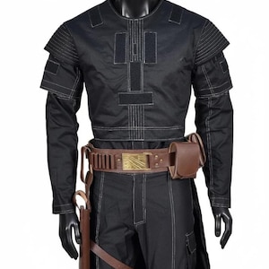 May include: Black costume with white stitching, displayed on a mannequin. The outfit includes a long-sleeved top with shoulder accents, matching pants, and a brown leather belt with a pouch and holster. The belt buckle has a gold design.