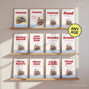 May include: A set of framed signs with a train theme. The signs have text such as "Custom", "Food", "Fueling Station", and "Party Favors". Each sign features a watercolor illustration of a train and is decorated with blue and white stripes.