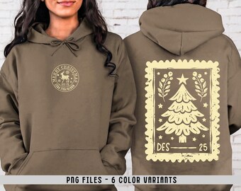 May include: A brown hooded sweatshirt featuring a small circular North Pole postmark graphic on the front chest and a large rectangular postage stamp design on the back, depicting a Christmas tree, stars, foliage, and the text DES 25.