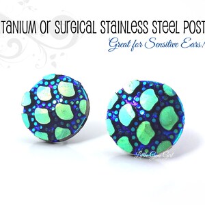 May include: A pair of blue and green patterned stud earrings with titanium or surgical stainless steel posts.  Great for sensitive ears!