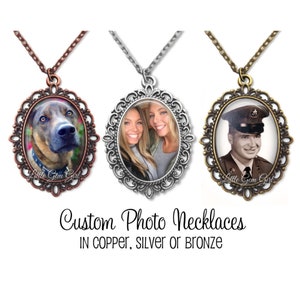 May include: Three custom photo necklaces with oval-shaped frames. The frames are ornate and have a filigree design. The necklaces are available in copper, silver, or bronze. The text "Little Gem Girl" is visible on two of the necklaces.