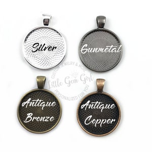 May include: Four round metal pendant blanks with different finishes: silver, gunmetal, antique bronze, and antique copper. Each blank has a decorative pattern and the finish name is printed in white.