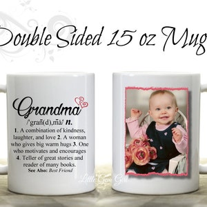 May include: White ceramic mug with a definition of "Grandma" on one side and a photo of a baby girl on the other side. The mug is 15 ounces.