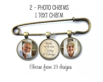 May include: A bronze safety pin with three charms. Two charms feature photos of people, and the third charm has the text "Walk with me Today & Always".