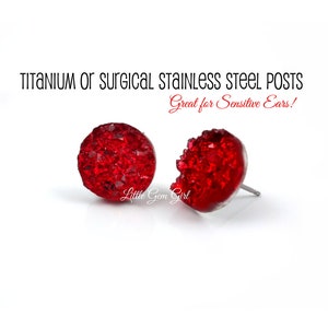 May include: Red crystal stud earrings with titanium or surgical stainless steel posts. Great for sensitive ears!