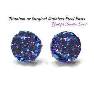 May include: A pair of blue and purple glitter stud earrings with titanium or surgical stainless steel posts.  Great for sensitive ears!  Little Gem Girl Personalized for You.