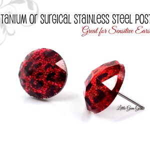May include: A pair of red glitter stud earrings with titanium or surgical stainless steel posts.  Great for sensitive ears!  Little Gem Girl.