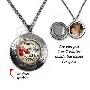 May include: Silver locket necklace with a red ruby slipper charm and the text "You've always had the power." The locket can be personalized with one or two photos.