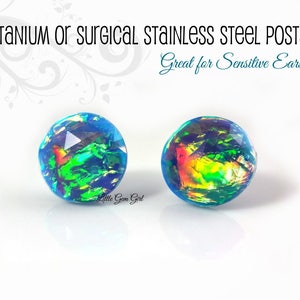 May include: A pair of iridescent blue opal earrings with titanium or surgical stainless steel posts. Great for sensitive ears!