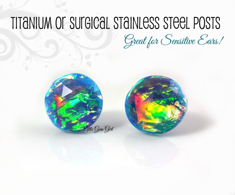 May include: A pair of iridescent blue opal earrings with titanium or surgical stainless steel posts. Great for sensitive ears!