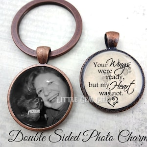 May include: Double-sided photo charm with a copper-toned metal frame. One side features a black and white photo of a woman and a dog. The other side has a white background with the text "Your Wings were ready, but my Heart was not." and paw prints.