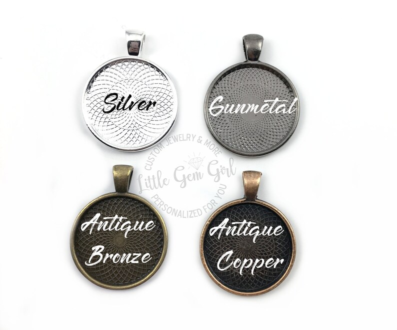 May include: Four round metal pendant blanks with different finishes: silver, gunmetal, antique bronze, and antique copper. Each blank has a decorative pattern and the finish name is printed in white.