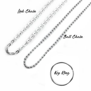 May include: Three silver chains, a link chain, a ball chain, and a key ring. The chains are laid out on a white background.