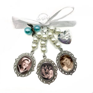 May include: A white pearl and rhinestone charm with three silver oval frames containing black and white photos. The charm also includes a silver heart charm with the text "You are always in my heart".