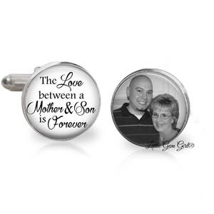 May include: A pair of silver cufflinks with a black and white photo of a mother and son on one cufflink and the text "The Love between a Mother & Son is Forever" on the other cufflink.