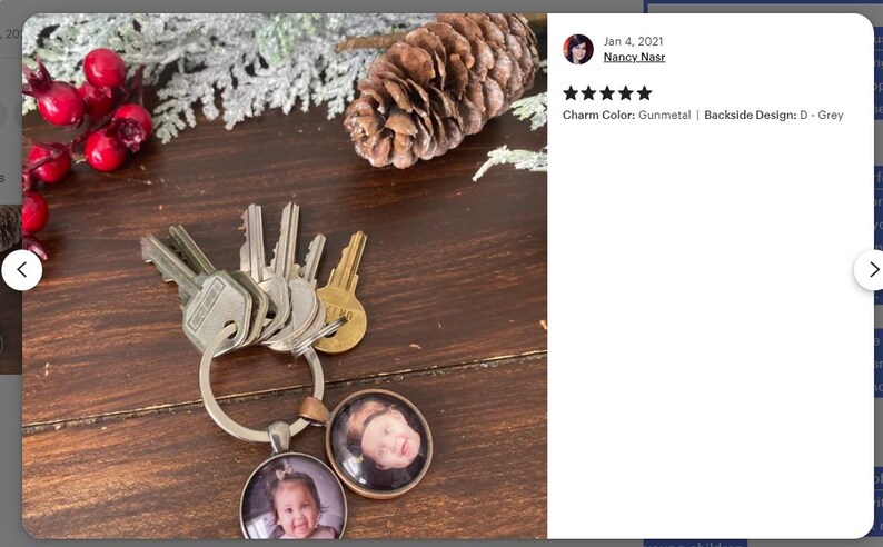 May include: A silver key chain with a gunmetal charm and two round photo inserts. The photo inserts feature pictures of children. The charm has the text "Charm Color: Gunmetal | Backside Design: D - Grey".