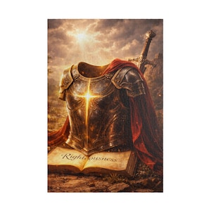 May include: A metallic breastplate with intricate engravings and a glowing cross emblem, draped with a red cloth. A sword stands behind the armour, which rests upon an open book with the word Righteousness printed on the page in a dark script.