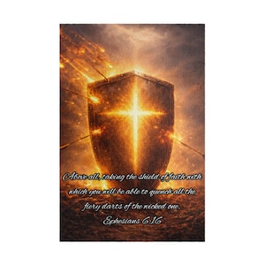 May include: A rectangular wall art print featuring a glowing golden shield with a bright cross in the centre, surrounded by fiery streaks. The text reads: Above all, taking the shield of faith with which you will be able to quench all the fiery darts of the wicked one. Ephesians 6:16.