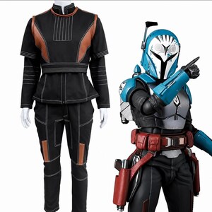 May include: A black long-sleeved top and pants set with brown accents and white stitching, displayed alongside a figure wearing a blue and white helmet, silver chest armor, red utility belt, and blue gauntlets with a pointing gesture.