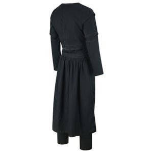 May include: A black outfit consisting of a long-sleeved jacket with shoulder detailing, a long skirt, and fitted pants. The jacket has a v-neck and a cinched waist. The skirt is pleated and falls to mid-calf. The pants are form-fitting.