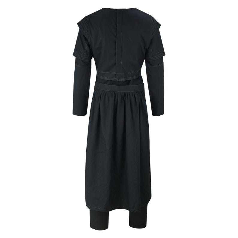 May include: A black two-piece outfit featuring a long-sleeved top with shoulder detailing and a long skirt. The skirt is paired with leggings. The outfit is made of a dark fabric and has a minimalist design.
