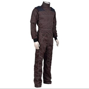 May include: Brown jumpsuit with a high collar and white stitching details. The long-sleeved top has shoulder pads and the pants have pockets. Black cuffs are visible at the wrists and ankles. The outfit is displayed on a mannequin.