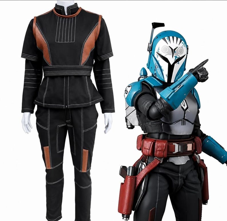 May include: A black long-sleeved top and pants set with brown accents and white stitching, displayed alongside a figure wearing a blue and white helmet, silver chest armor, red utility belt, and blue gauntlets with a pointing gesture.
