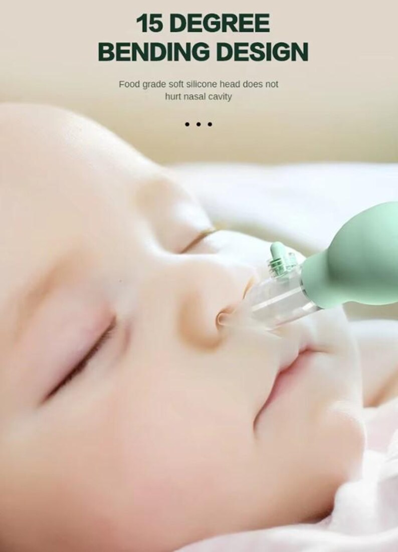 May include: A close-up of a baby's face with a green and clear nasal aspirator. The aspirator has a 15-degree bending design and a soft silicone head. Text on the image reads: "15 DEGREE BENDING DESIGN" and "Food grade soft silicone head does not hurt nasal cavity."