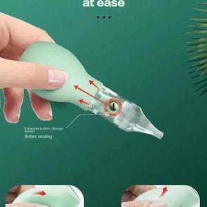 May include: A light green baby nasal aspirator with a clear tip, held by a hand. The aspirator has an anti-backflow design and the text "Clear your baby's nose at ease". The image also shows the words "Enhanced suction, stronger suction" and "Better sealing".