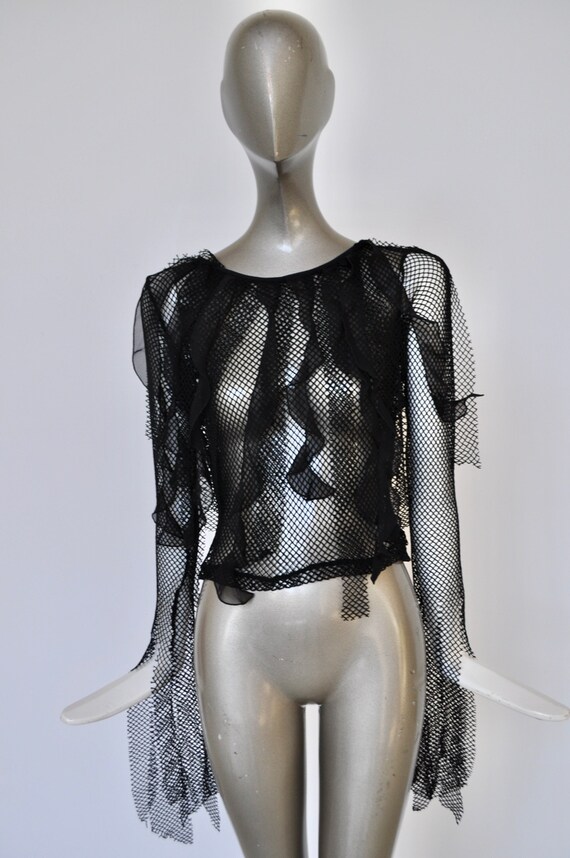 Netted top very avant garde