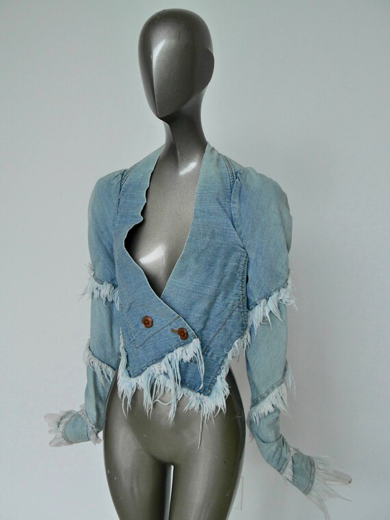 Vivienne Westwood jacket, slashed and cut jeans co