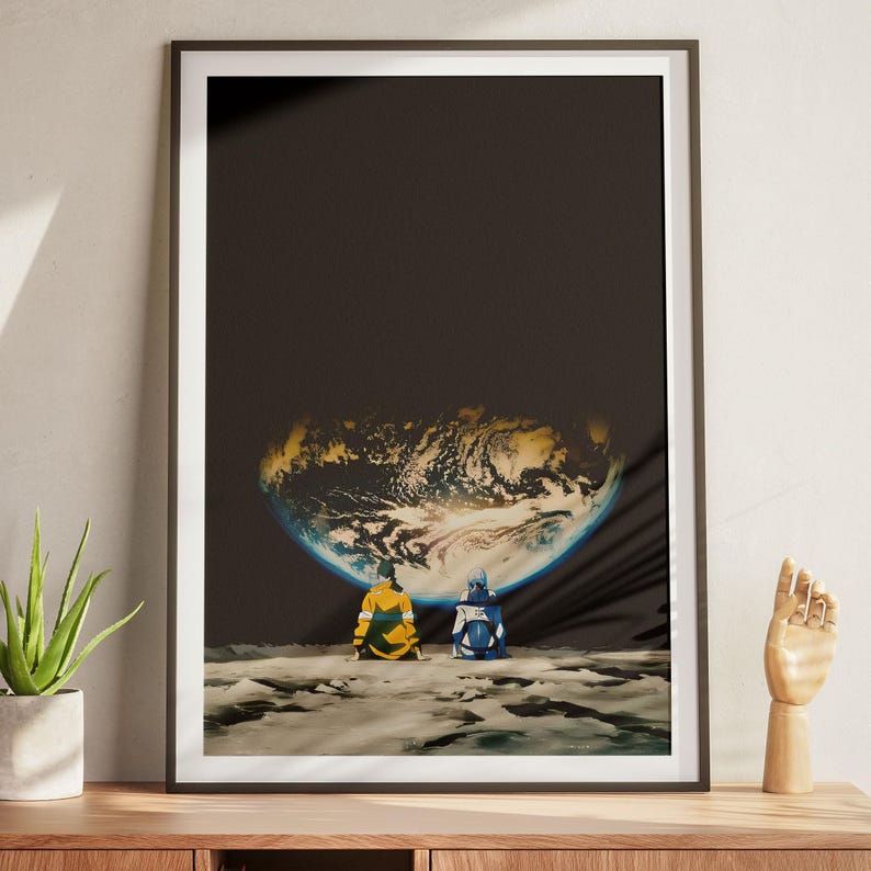 May include: A framed art print featuring two figures sitting on a rocky lunar surface, viewed from behind. They are looking up at a large, glowing Earth suspended in a dark, vast space. The figure on the left wears a yellow jacket, while the figure on the right wears a blue and white outfit. The composition emphasizes the contrast between the dark void and the illuminated planet.