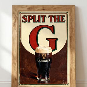 May include: Framed vintage-style Guinness beer advertisement. The poster features a pint of dark stout with a creamy head, set against a brown and cream background. The text "SPLIT THE G" is prominently displayed in red.