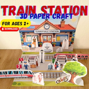May include: A 3D paper craft train station playset with the text "TRAIN STATION 3D PAPER CRAFT" and "FOR AGES 2+". The scene includes a station building, trains, people, and a tree. The station is labeled "SUNNYVALE STATION".