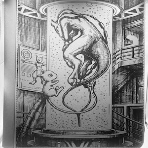May include: Black and white illustration of a Pokemon binder featuring Mewtwo and Mew. The artwork depicts Mewtwo inside a cylindrical container, with Mew and other elements of a laboratory setting. The binder has a silver border and a metal clasp.