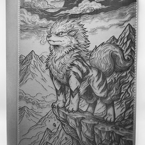 May include: A gray binder featuring a detailed illustration of a wolf-like creature perched on a cliff, with a mountain range and a full moon in the background. The artwork is in a detailed, grayscale style, with a solid gray spine.